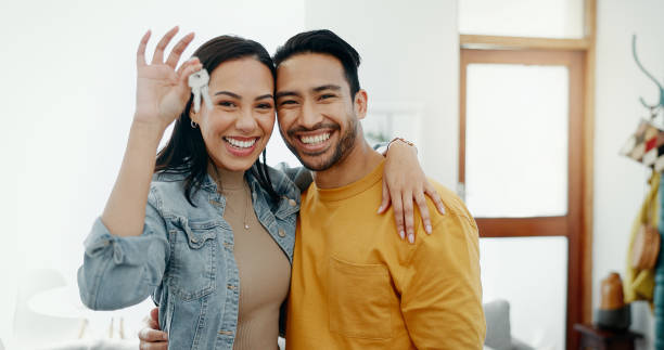 Friendly couple smiling in a warm home interior